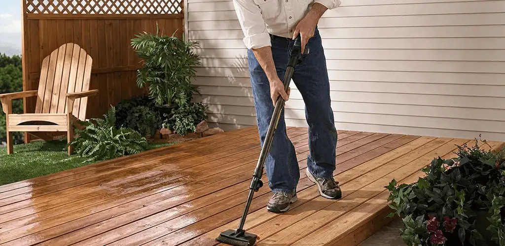 Deck staining service applying stain to a backyard wood deck in Long Beach, CA